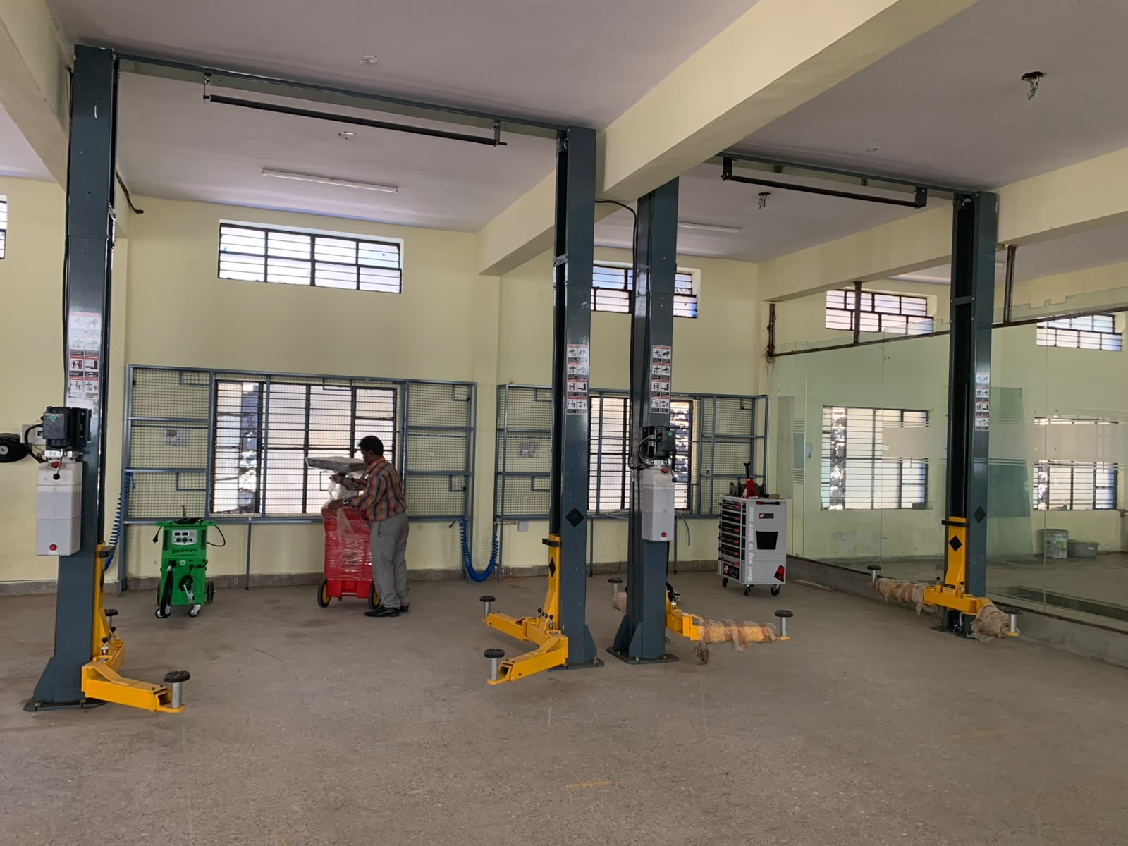 Our service bays with modern two-post lifts — General Service in Bengaluru